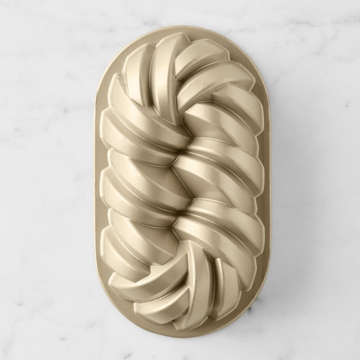 https://www.mytoque.com/cdn/shop/products/nordic-ware-75th-anniversary-braided-loaf-pan-o_710x.jpg?v=1653073294
